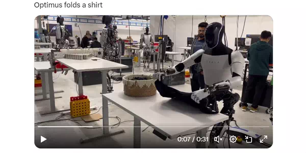 Tesla Optimus folds a shirt